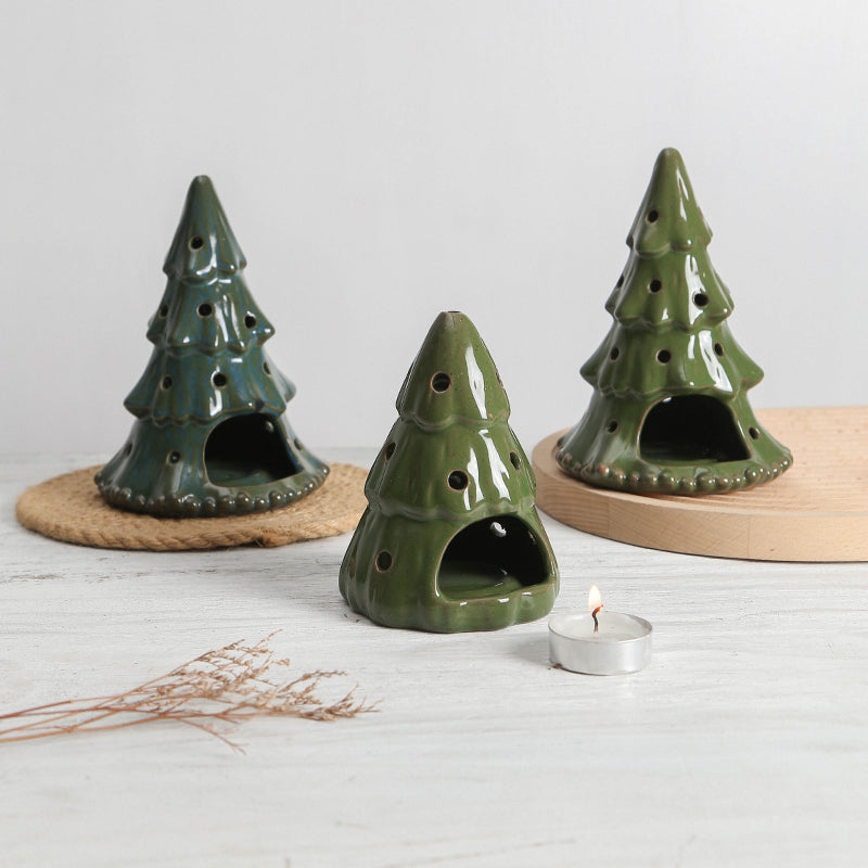 Tarro de vela con diseño de árbol de Navidad.